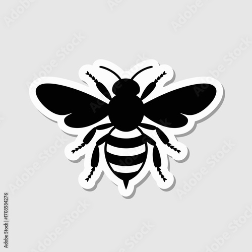 Black silhouette of a bee with striped abdomen on a white background