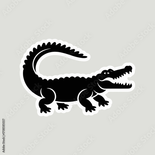 Black silhouette of a crocodile with open mouth on a light gray background