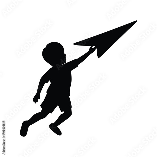 Silhouette of a child throwing a paper airplane into the sky