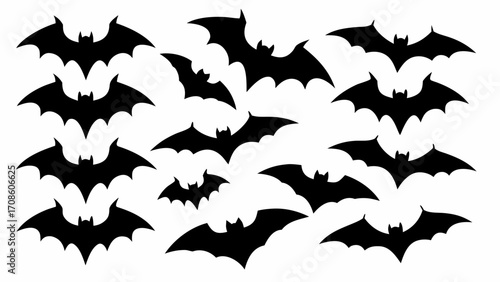 Eerie swarm of black bat silhouettes soaring for Halloween spooky season decor and graphic elements