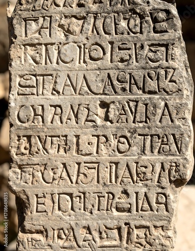 Ancient stone inscription with carved text