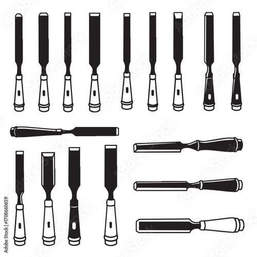 Collection of black and white chisels and gouges on a white background