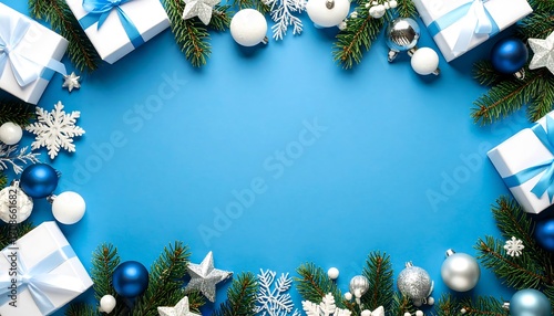 Christmas gifts and ornaments on a vibrant blue background