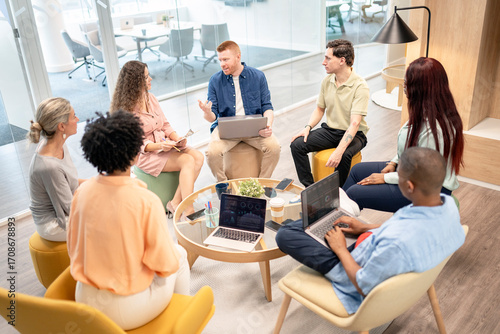 Multicultural team collaborating during office meeting