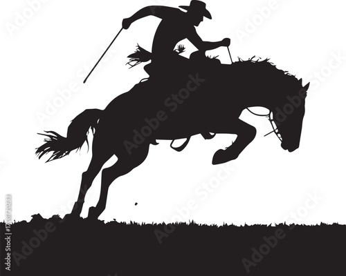 Silhouette of a Cowboy Riding a Bucking Bronco in a Rodeo