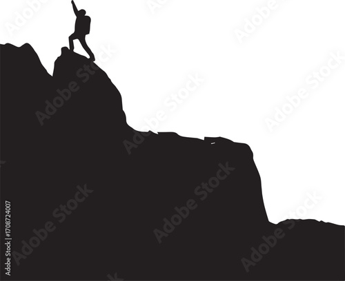 Silhouette of a triumphant hiker raising arm on a mountain peak