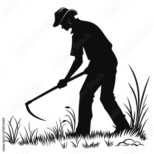 Farmer cutting grass with sickle