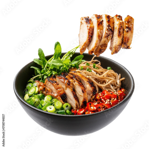 Grilled Chicken Noodle Bowl with Fresh Vegetables and Spicy Garnish in a Modern Black Dish on transparent background