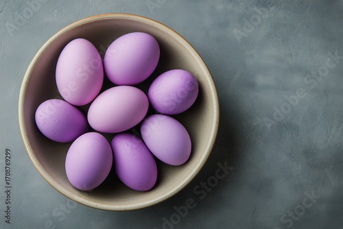 Colorful Purple Eggs in a Bowl Ready for Decoration During Spring Celebrations