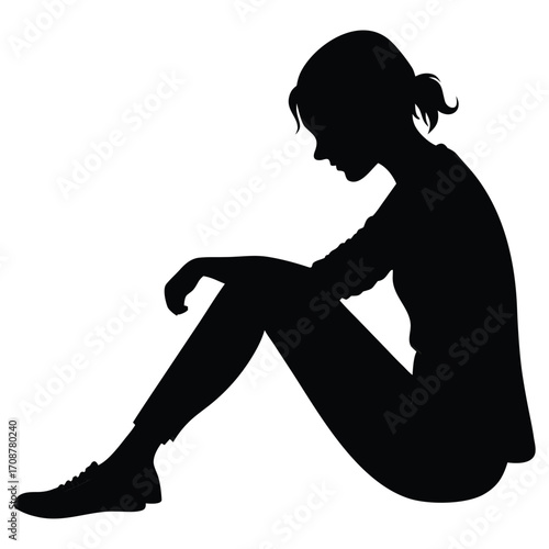 Woman sitting with knees up