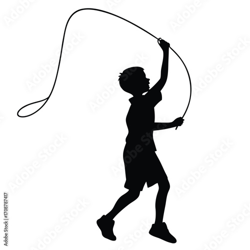 Boy holding skipping rope above head