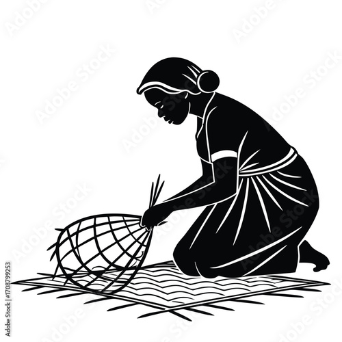 Woman weaving mat on floor