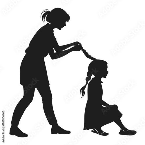 Girl braiding child’s hair