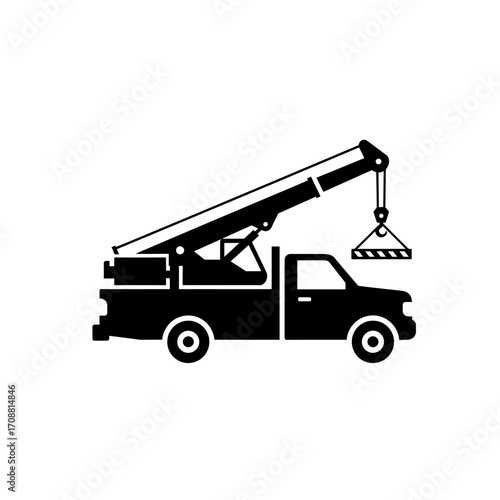 Silhouette of a black tow truck with a crane lifting a load against a white background
