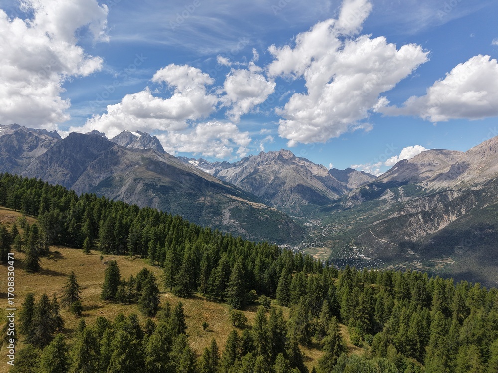 Fototapeta premium Alpine Wilderness | Les Écrins National Park – Summit ViewAerial drone photo of a pristine alpine summit in the French Alps, taken in the heart of Les Écrins National Park. Rolling ridge-lines