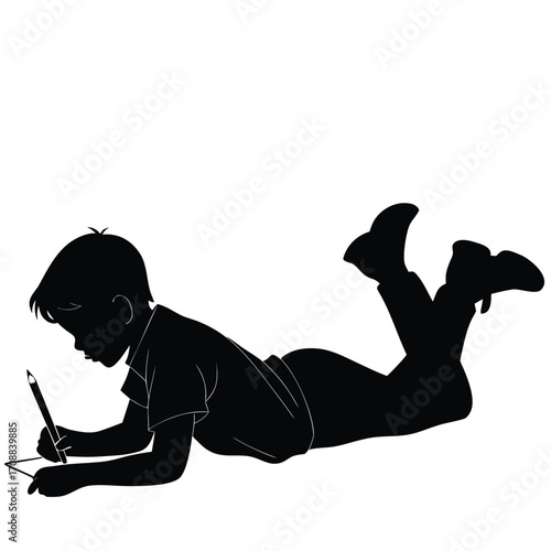 Boy lying face down with pencil