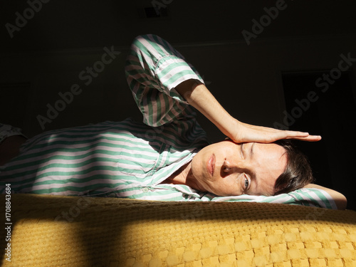 Sleepy Woman in Bed