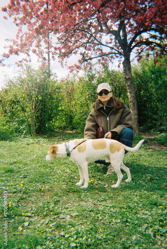 Woman spends time with her dog outdoors
