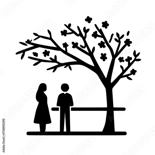 Couple shares moment under blooming spring tree