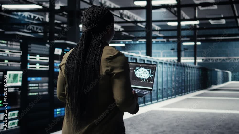 Programmer doing data center automation using AI software tools ...