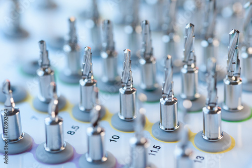 Selective focus of dental implant drill bit in surgical tray, professional dentistry equipment