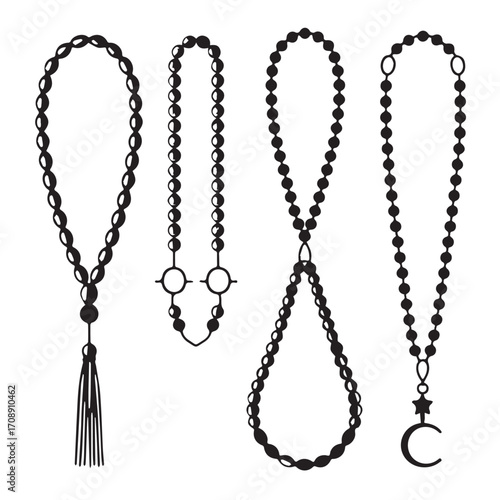 Collection of four black prayer beads or rosaries with tassels and religious charms on a white background