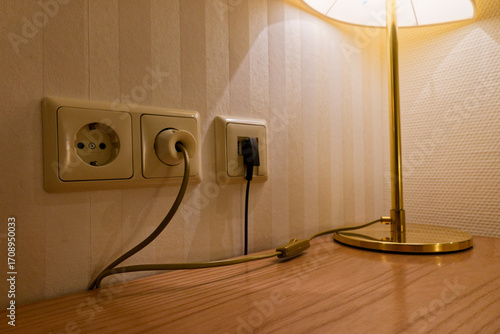 Power sockets with desk lamp and active data port in use