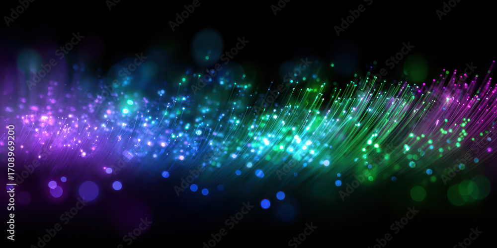 Obraz premium Vibrant display of colorful fiber optic lights creates mesmerizing and futuristic atmosphere against dark background. glowing strands shades of purple, blue, and green evoke sense of wonder