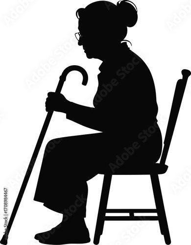 Elderly woman with a cane sitting peacefully silhouette