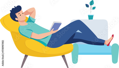 Relaxed man in a chair, engaged with a book and a tablet resting on his lap.