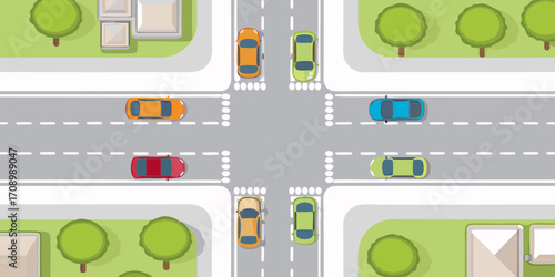 Aerial view of a busy city intersection with cars driving on roads and crossing pedestrian walkways