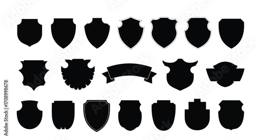 Assortment of Black Shield and Banner Silhouettes on White Background emblem crest