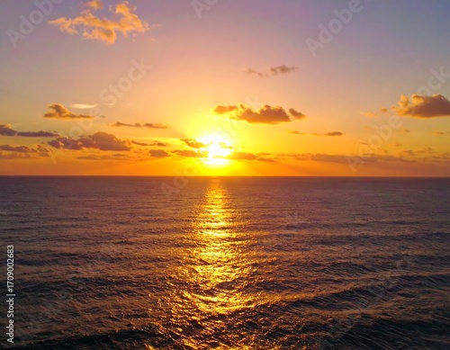 Golden sunset over tranquil ocean