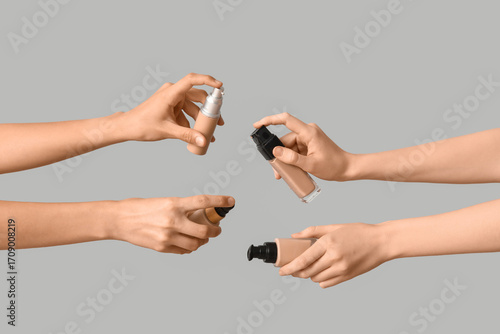 Multiple hands holding foun...