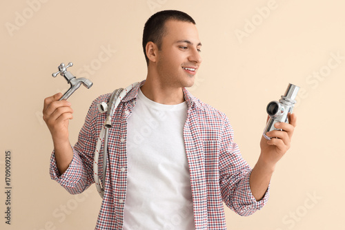 Male plumber with spigot an...