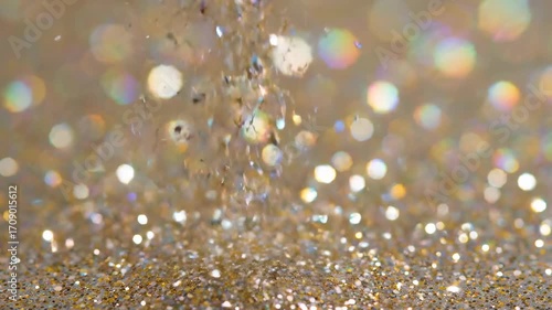 A dynamic seamlessly looping video of shimmering glitter particles rising and falling, creating a festive, ethereal effect wedding, presentation, shiny