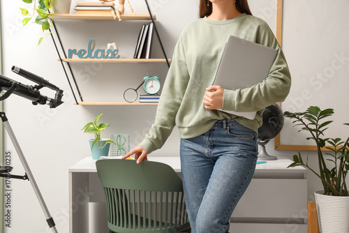 Female inventor with laptop...