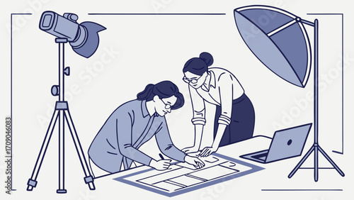 Two colleagues reviewing a project together in a studio setting.