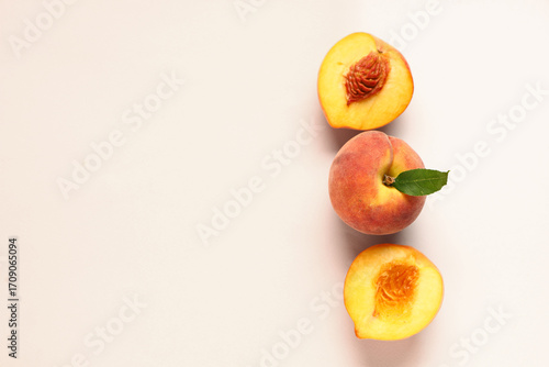 Sweet ripe peaches on beige...
