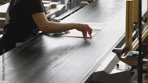 Crafting custom cardboard packages at a bustling factory, showcasing skilled hand-gluing techniques and precision in action