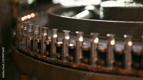 Metal cartridge cases transported by conveyor at plant