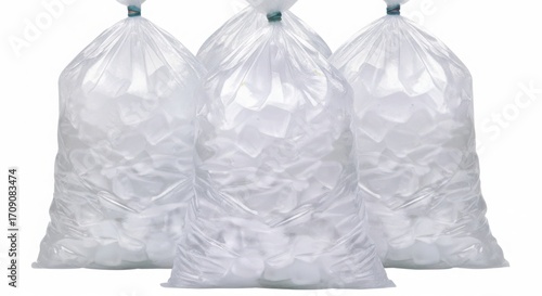 Three clear plastic bags filled with ice cubes on a white background
