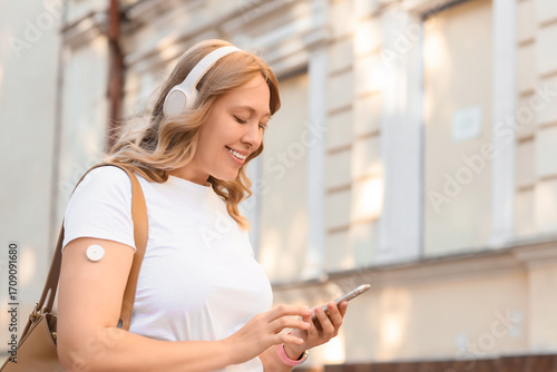 Diabetic woman in headphone...