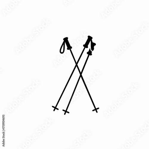 Crossed black ski poles with hand straps and snow baskets, winter sports equipment