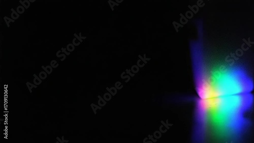 A captivating light spectrum display against a deep black backdrop creates a vibrant visual abstract, ideal for use in modern design projects and innovative presentations.