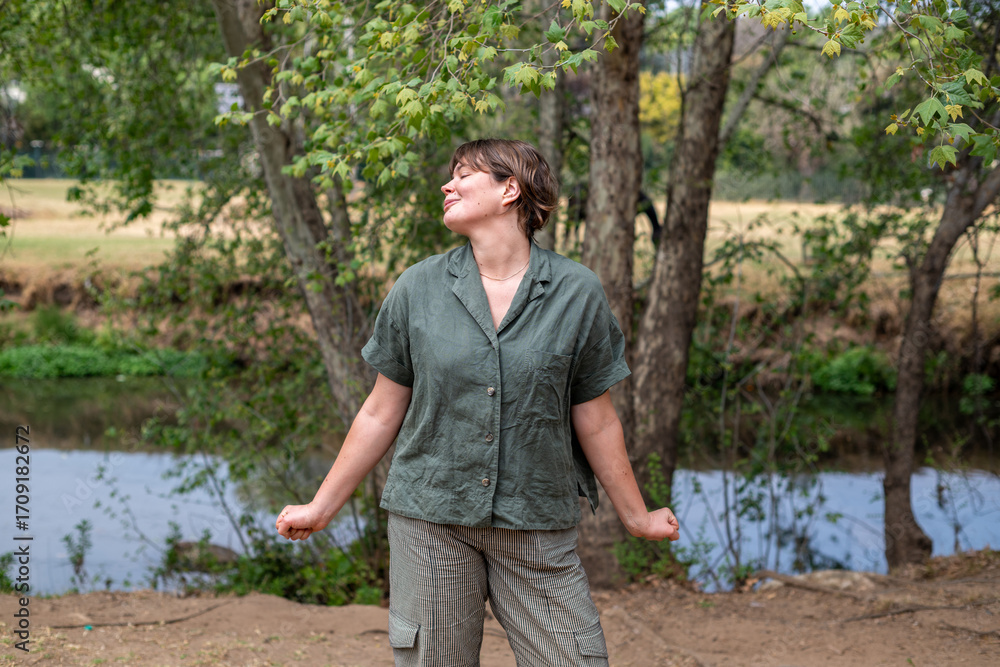 Fototapeta premium Happy woman seen in nature