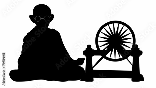Silhouette of a man with glasses sitting next to a spinning wheel on a white background in black color