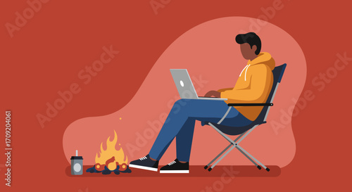 Senior African American woman comfortably working on a laptop from a bean bag chair, representing modern remote work and digital lifestyle.