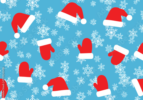 A festive collection of red santa hats and mittens scattered across a vibrant blue background filled with white snowflakes creating a cheerful winter holiday pattern.