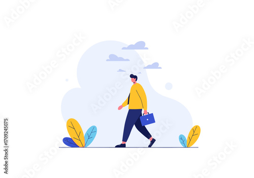 A businessman walks carrying a briefcase and dressed in casual office attire.